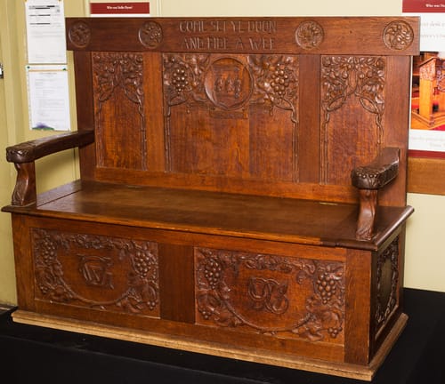 Settle carved for Mrs Gibson.